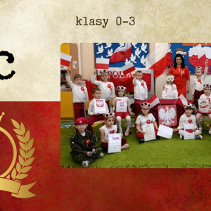 grupa najmłodszych uczniów w biało-czerwonych strojach prezentuje patriotyczne prace i trzyma polskie flagi.