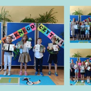 nagrodzeni uczniowie klas 1-3 oraz organizatorzy Konkursu Pięknego Czytania na tle barwnej dekoracji